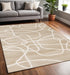 8' X 11' Cream And Tan Abstract Area Rug