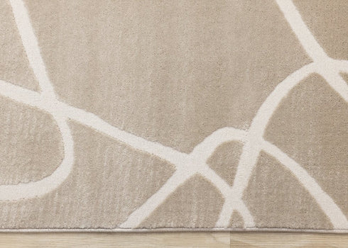 8' X 11' Cream And Tan Abstract Area Rug