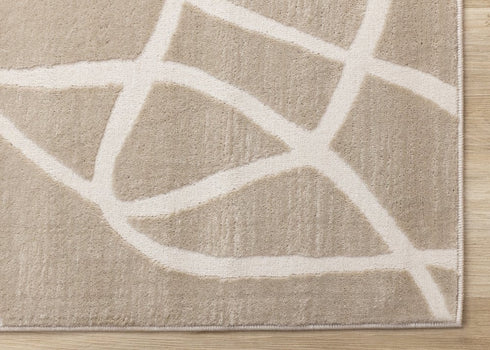 8' X 11' Cream And Tan Abstract Area Rug