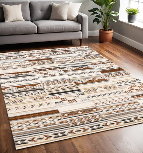 5' X 8' Cream Black And Brown Tribal Area Rug