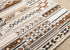 5' X 8' Cream Black And Brown Tribal Area Rug