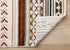 5' X 8' Cream Black And Brown Tribal Area Rug