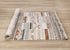 5' X 8' Cream Black And Brown Tribal Area Rug
