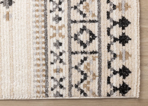 5' X 8' Cream And Black Tribal Area Rug