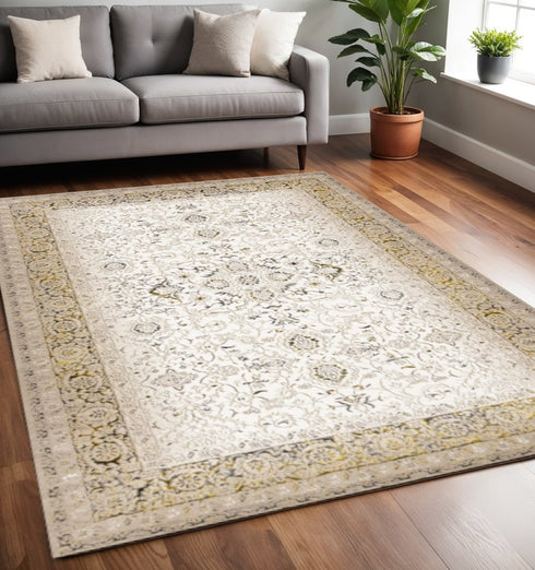 5' X 8' Cream Black And Tan Medallion Area Rug