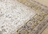 5' X 8' Cream Black And Tan Medallion Area Rug