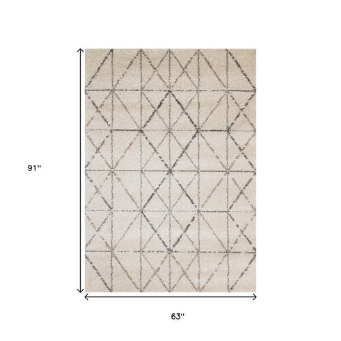 5' X 8' Cream And Gray Tribal Area Rug