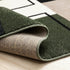 5' X 8' Green Black And Ivory Geometric Area Rug