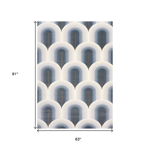5' X 8' Cream And Blue Geometric Area Rug