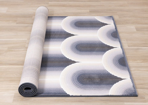 5' X 8' Cream And Blue Geometric Area Rug