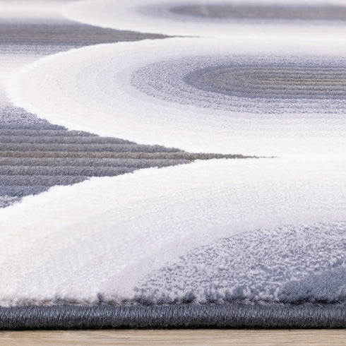 5' X 8' Cream And Blue Geometric Area Rug