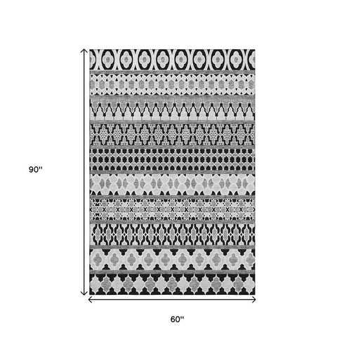 5' X 8' Black And Ivory Ikat Washable Area Rug With UV Protection