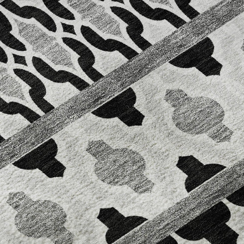 5' X 8' Black And Ivory Ikat Washable Area Rug With UV Protection