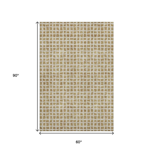 5' X 8' Gold And Ivory Geometric Washable Area Rug With UV Protection