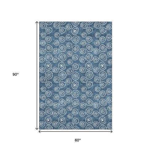 5' X 8' Blue And Ivory Polka Dot Washable Area Rug With UV Protection