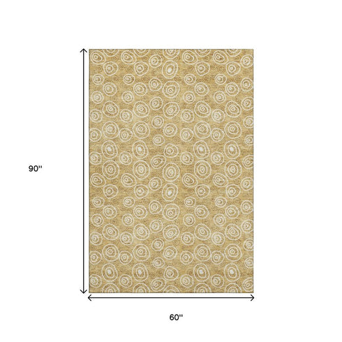 5' X 8' Gold And Ivory Polka Dot Washable Area Rug With UV Protection