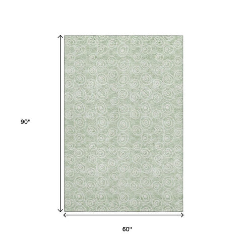 5' X 8' Mint Green And Ivory Polka Dot Washable Area Rug With UV Protection