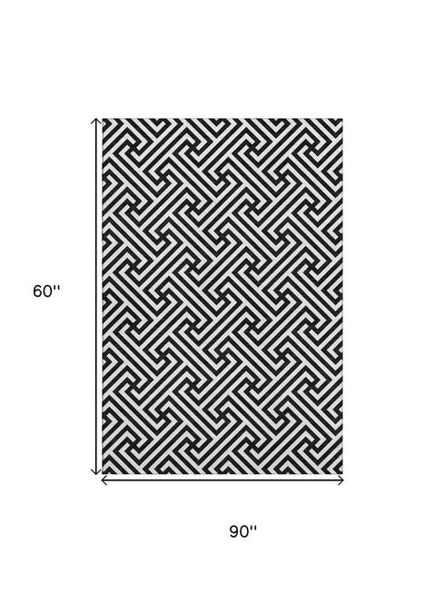 5' X 8' Black And Ivory Geometric Washable Area Rug With UV Protection
