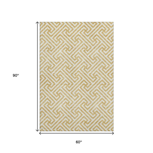 5' X 8' Gold And Ivory Geometric Washable Area Rug With UV Protection