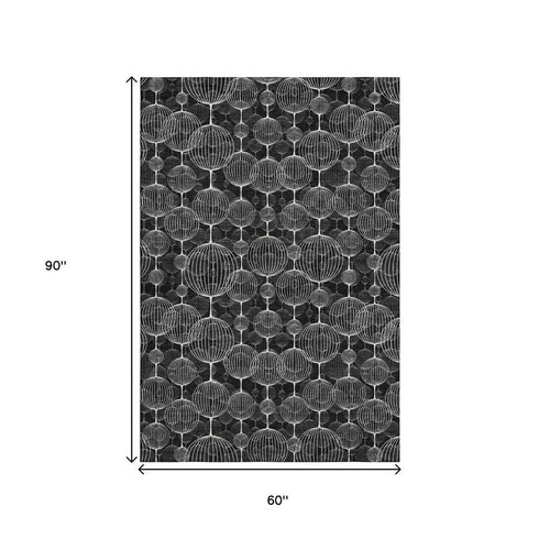 5' X 8' Black And Ivory Geometric Washable Area Rug With UV Protection