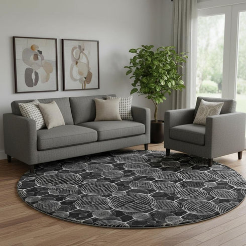 8' Black And Ivory Geometric Washable Round Rug With UV Protection