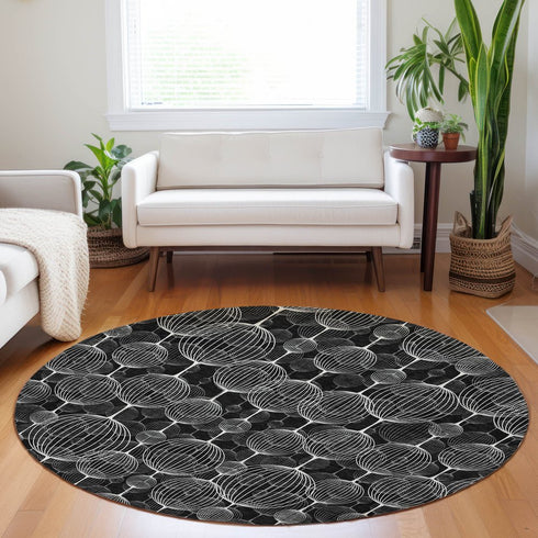 8' Black And Ivory Geometric Washable Round Rug With UV Protection