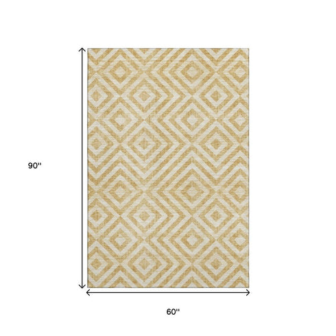 5' X 8' Gold And Ivory Geometric Washable Area Rug With UV Protection