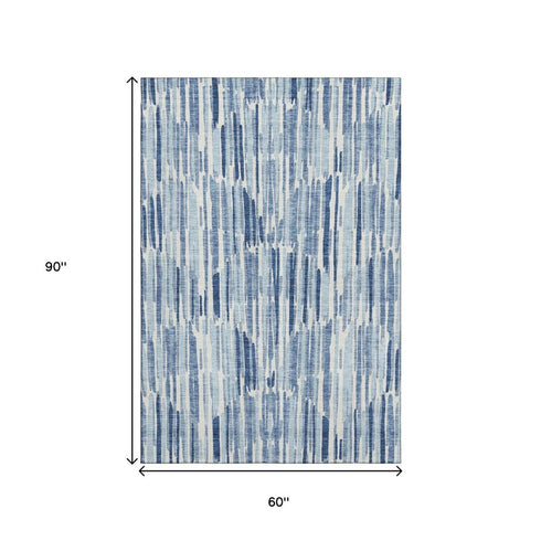 5' X 8' Blue And Ivory Abstract Washable Area Rug With UV Protection