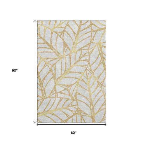 5' X 8' Gold And Beige Floral Washable Area Rug With UV Protection