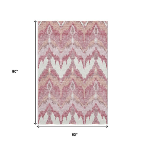 5' X 8' Blush Ivory And Pink Ikat Washable Area Rug With UV Protection
