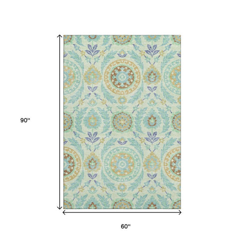 5' X 8' Mint Green Blue And Beige Floral Washable Area Rug With UV Protection