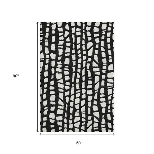 5' X 8' Black And Ivory Cobblestone Washable Area Rug With UV Protection