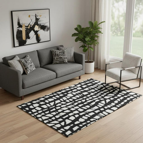 5' X 8' Black And Ivory Cobblestone Washable Area Rug With UV Protection