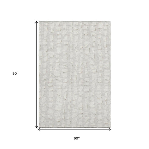 5' X 8' Ivory And Beige Cobblestone Washable Area Rug With UV Protection