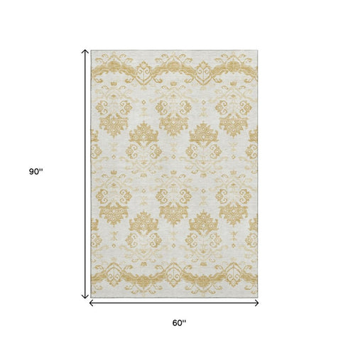 5' X 8' Gold And Beige Medallion Washable Area Rug With UV Protection