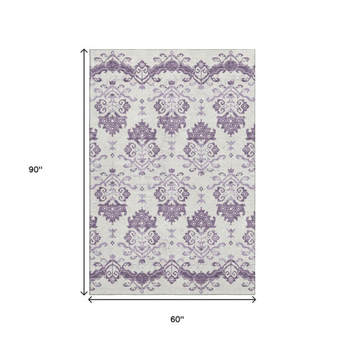 5' X 8' Purple And Ivory Medallion Washable Area Rug With UV Protection