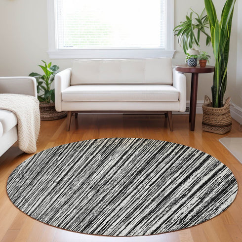 8' Black And Ivory Striped Washable Round Rug With UV Protection