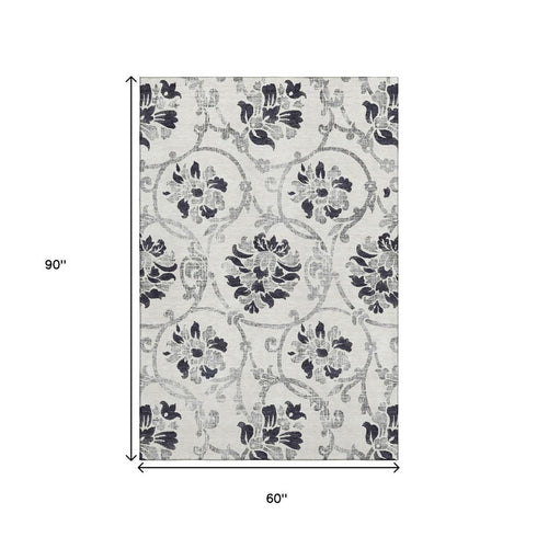 5' X 8' Black And Ivory Floral Washable Area Rug With UV Protection