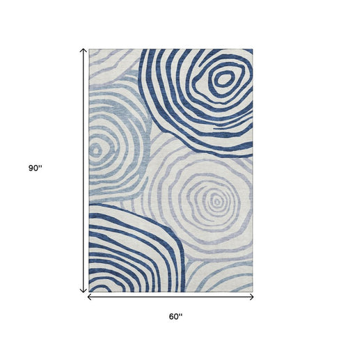 5' X 8' Blue And Ivory Abstract Washable Area Rug With UV Protection