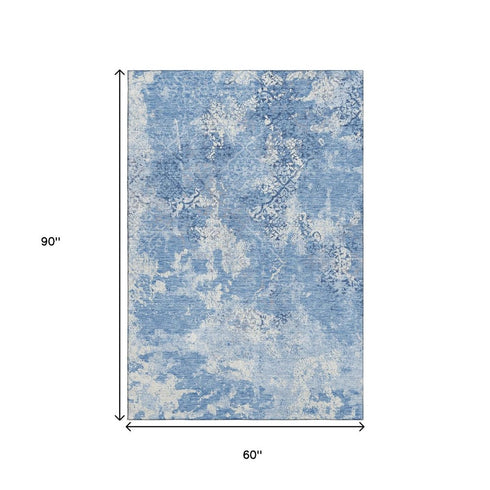 5' X 8' Blue And Ivory Abstract Washable Area Rug With UV Protection