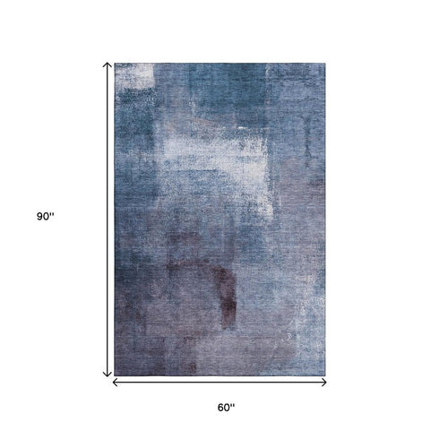 5' X 8' Navy Blue And Ivory Abstract Washable Area Rug With UV Protection