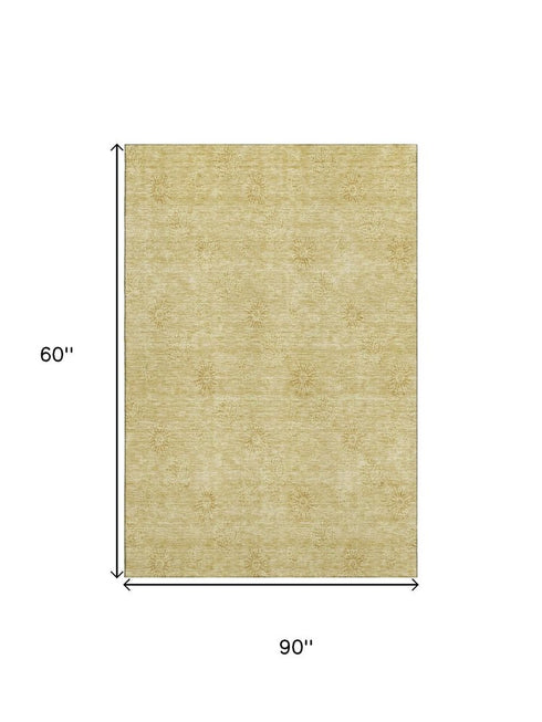 5' X 8' Gold And Ivory Floral Washable Area Rug With UV Protection