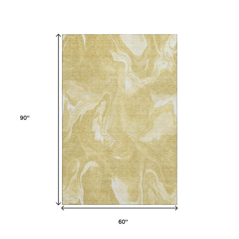 5' X 8' Gold And Ivory Abstract Washable Area Rug With UV Protection