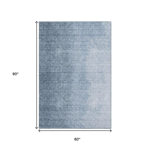 5' X 8' Blue And Ivory Ombre Washable Area Rug With UV Protection