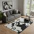 5' X 8' Black And Ivory Floral Washable Area Rug With UV Protection