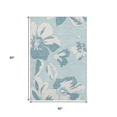 5' X 8' Teal And Ivory Floral Washable Area Rug With UV Protection
