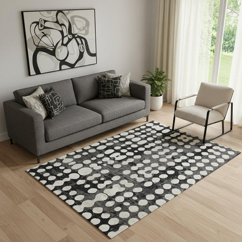 5' X 8' Black And Ivory Polka Dot Washable Area Rug With UV Protection