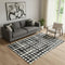 5' X 8' Black And Ivory Polka Dot Washable Area Rug With UV Protection