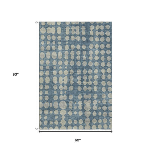 5' X 8' Denim Blue And Beige Polka Dot Washable Area Rug With UV Protection