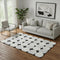 5' X 8' Black And Ivory Abstract Geometric Washable Area Rug With UV Protection